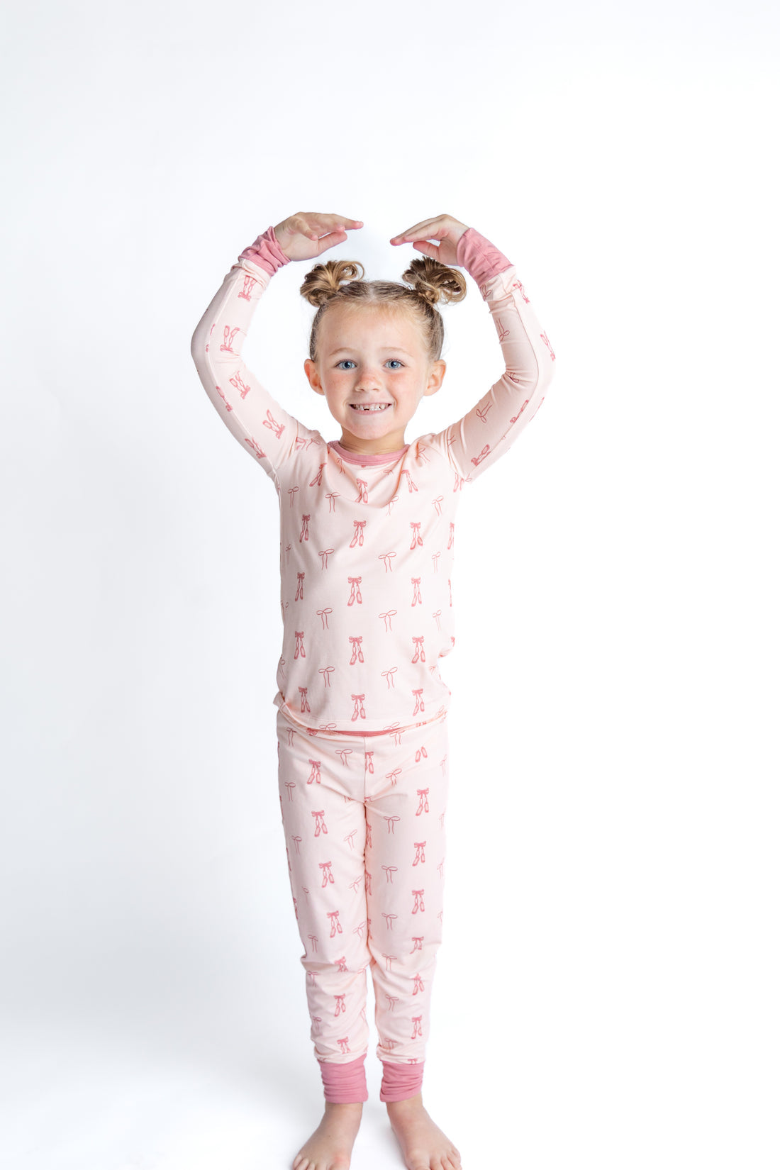 Child wearing pink ballet bamboo pajamas
