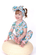 Child wearing spring floral bamboo pajamas