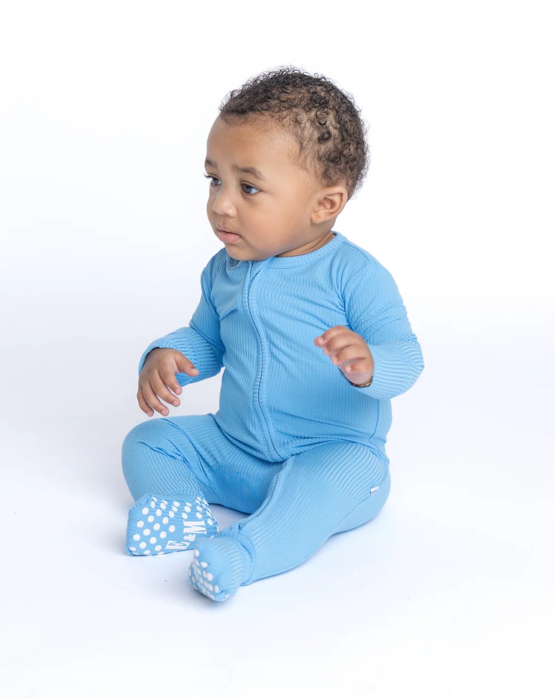 Baby in blue bamboo zippy 