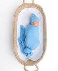 Baby swaddled in blue bamboo blanket